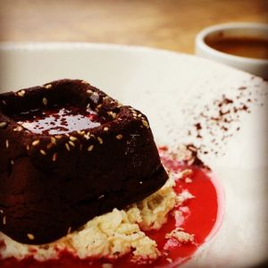 Chocolate Tahini Cake - rich, dense and nutty, served with raspberry coulis and halva crumble at Rosemary and Vine in Rye
