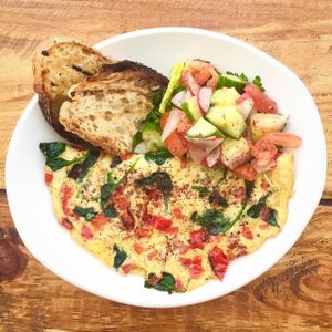 Special: Grandpa Krikor's Omelette with Sumac- organic eggs, spinach, feta and red peppers. Served with a side Fatoush salad and grilled seven grain bread at Rosemary and Vine in Rye