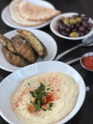Hummus, olives, potato wedges  at Rosemary and Vine in Rye