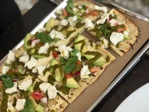 Flatbread with veggies and tree line nut cheese.  at Rosemary and Vine in Rye