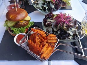 Forrest Gump Burger with sweet potato fries and a salad at Samses in Zurich