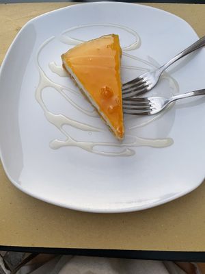 Panna cotta cake with mango-coconut topping  at Mezzaluna in Turin