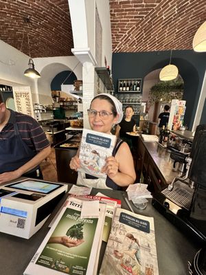 Owner and her cookbook!   at Mezzaluna in Turin