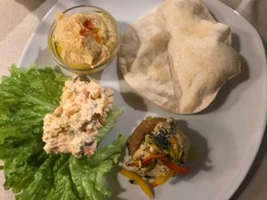 Three of the starters: hummus & flatbread, quinoa flan and Russian salad at Mezzaluna in Turin