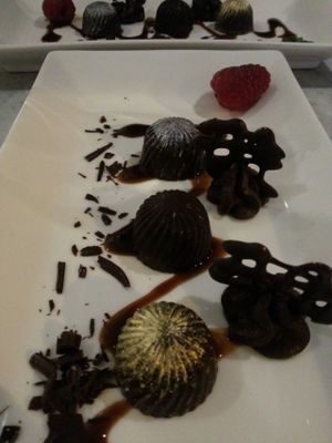 Trio of chocolate 'bomb': 3 vegan chocolates with marzipan, cherry and caramel, served with chocolate ganache swirls at 1847 in Brighton