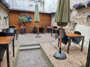 outdoor seating at the back at Books & Brunch in Bruges