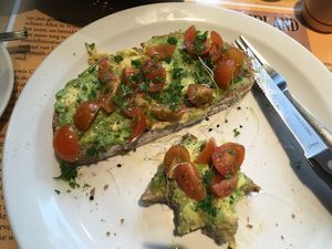 Half eaten (sorry!) avo on toast at Books & Brunch in Bruges