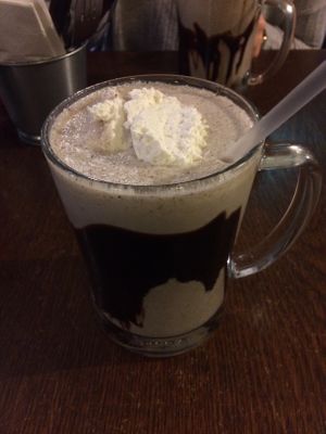 Vegan milkshake with almond milk and Oreo flavor, topping is coconut cream  at Maggie Mays in Belfast