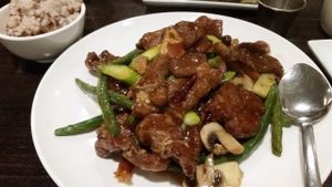 Crispy seitan orange chicken with fresh vegetables and brown rice at Green Zenphony in Rego Park