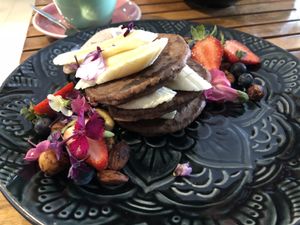 Buckwheat Pancakes with Cacao, Vanilla & Fresh Berries, Banana and Granola at Betty's Bohemian Beach Cafe in Port Douglas