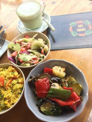 Cous cous, veggies, salad and matcha cappuccino made with almond milk at SOPA in Tenerife