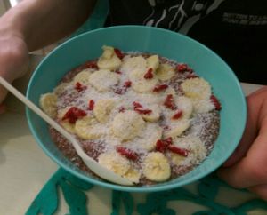 vegan porridge with coco, banana, coconut and goji berries  at Milk Away in Sevilla