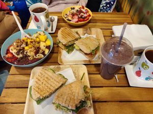 Açai bowl, porridge, smoothie (with ingredients I chose) and paninis at Milk Away in Sevilla