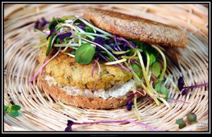 "Bagel and Cream Cheese" - toasted sprouted whole grain English Muffin with Cashew Cream Cheese, optional homemade Cannellini Bean Sausage, and microgreens. Can be GF.  at Purple Sprout Conscious Organics in Buffalo Grove
