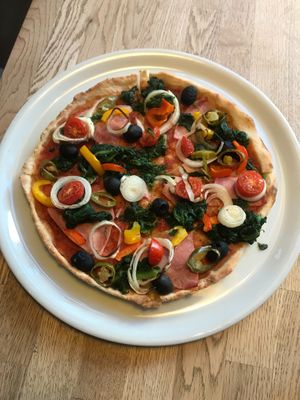 Pizza with veggies and vegan bacon! at Yummies in Hamburg