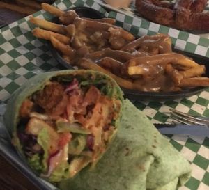 Spicy Tiger Wrap with veg Poutine Fries  at The Ice Haus in Murray