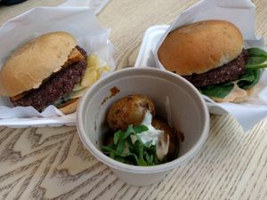 hammer and plant burgers with side potatoes at The Plant in Stockholm