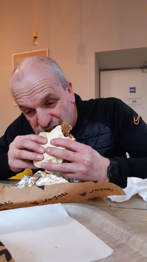 My dad probably wouldn't be too happy that I shared this sneaky quick photo of him gorging on his Aloha haha =P" at Vegab in Krakow