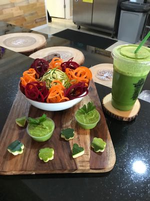 Zucchini Spaghetti and a fresh pressed Eden Greens drink.  at Utopia Juice Bar in Pompano Beach