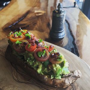 Roasted Sweet Potato with Smashed Avocado, Heirloom Tomato and Balsamic Caviar  at Utopia Juice Bar in Pompano Beach