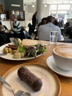 Punschrulle, Cappuccino & Hummustallrik  at Gamla Bibliotekscafeet in Umea