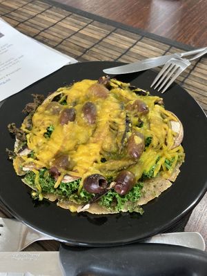 Pizza, many toppings, but small pizza overall at Raw Balance Raw Food Deli in Taupo