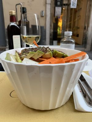 Huge salad with a blend of lettuce, fennel, herbs, carrots, avocado, blend of seeds, almond and raisins  at Ginger in Rome