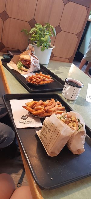 Cheeseburger, hash brown wrap, and sweet potato fries at Swing Kitchen - Operngasse in Vienna
