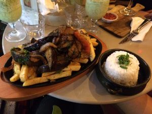 Flame grilled eggplant and onion on a bed of fried potato with a side of rice. A bit oily, but delicious!
Also in the picture is the bottom of the lime and mint frappe. Very refreshing! at ExotiK in Newtown