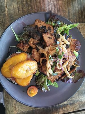 "Livin' la vida loca": beefless strips stirfried with mushrooms, capsicums and onions; served with rice and beans, crunchy onion and fried plantain at ExotiK in Newtown