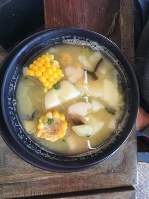 Ajiaco, a Colombian soup. Comes with a side place of rice, avocado and a small bowl of capers.  at ExotiK in Newtown