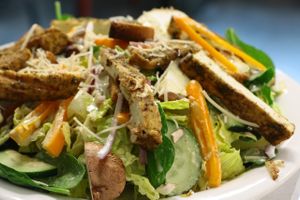 Traditional salad with lots of veg, dill dressing, and grilled buddha meat at 701 Coffee in Seattle