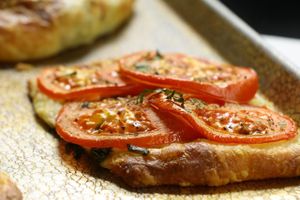 tomato crisp with house-made cashew cheese, basil, and heirloom tomato at 701 Coffee in Seattle