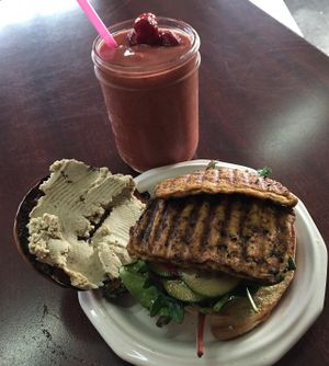 Bagel sandwich w/buddha tofu, mixed greens, cucumber, bell pepper on artisan bagel. at 701 Coffee in Seattle