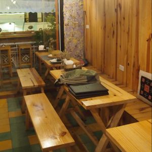 wooden seating area at Jalus Vegan Kitchen in Hanoi