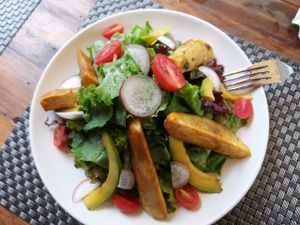 Jalus garden salad with sweet potato wedges
 at Jalus Vegan Kitchen in Hanoi