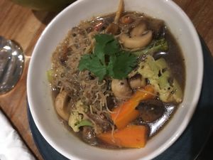 RICE NOODLE SOUP: Rice noodle, shallot, garlic, ginger, coriander, mushrooms, carrot, broccoli, tamari, leek, and lime juice at Yoga Searcher in Pecatu