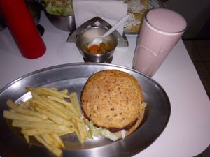 Hamburger (lentils and seeds) fries and yogurt milkshake. at Govinda Ram in Mexico City