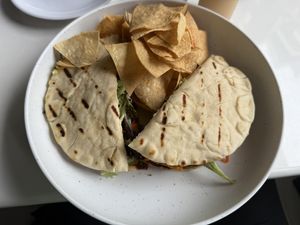 Veggie burger on pita with freshly made tortilla chips.  at Pure Fresh Food and Juice Bar in San Juan