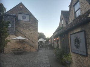 View of the entrance and beer garden at The Royal Oak in Tetbury