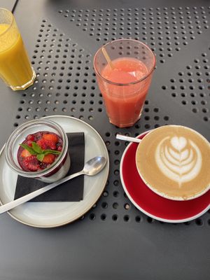 Tapioca Pudding, grapefruit juice and oat milk latte. at Wesola Cafe in Krakow