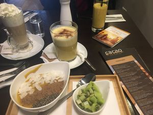 Mango Superfood Bowl without granola, Tropical Smoothie and Golden Milk   at cacao in Prague