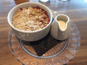 crumble of the day (rasberry) with home made custard  at Mildreds - Camden in North West London