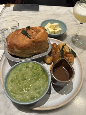 Vegan pie with mushy peas, gravy and roast potatoes.   at Mildreds - Camden in North West London