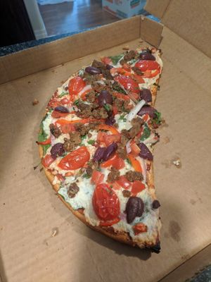 Shaganappi with vegan mozzarella and Beyond sausage crumbles at The Village Flatbread Co. in Calgary