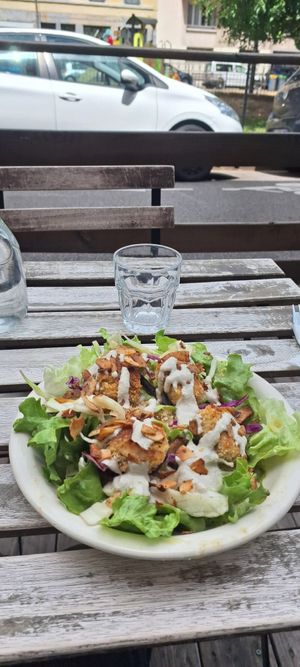 Tofu pané sauce caesar, salade verte, quinoa, chou, chips de coco at Against the Grain in Lyon
