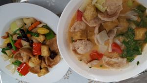 Vegan stir fried cashew nuts (left) and tom yum (right). at Spices and Herbs in Chiang Mai