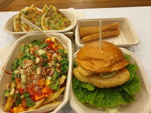 Garlic butter scallion pancake; Churros; Banh mi loaded fries; Omni fishless burger at Woking Amazing in Northcote