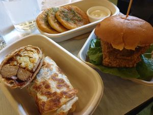 Eggy roll w/italian Beyond sausage $17.00, Garlic butter potato cake $11.00, Zinger chikn burger $17.00 at Woking Amazing in Northcote