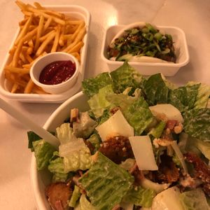 Chicken Caesar salad, bao & fries at Woking Amazing in Northcote